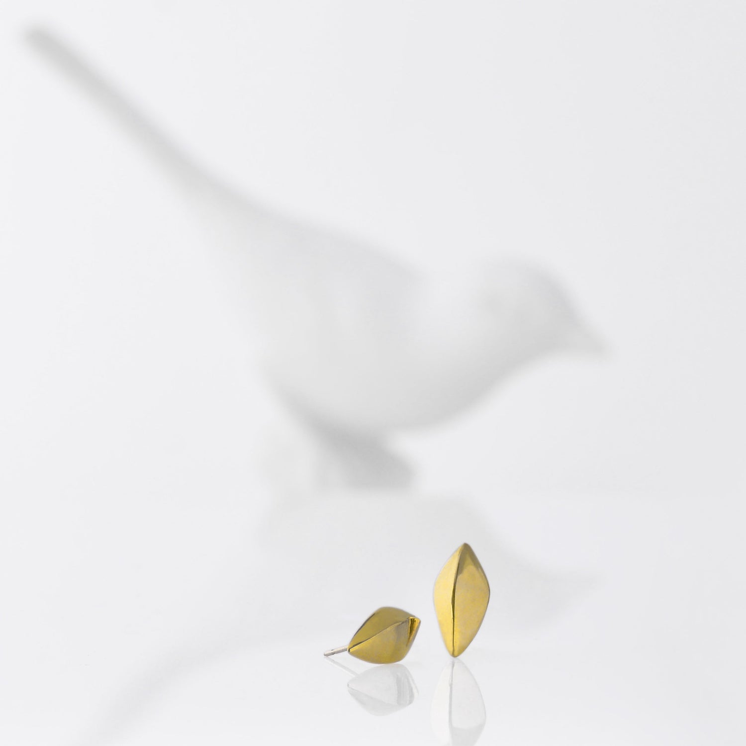 18kt Post Earrings in the shape of a modern leaf. Designed and made by Susan Crow in 18kt Fairmined yellow gold. 3/4" long x .25" wide