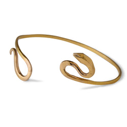 Odyssey snake cuff bracelet is hand carved and cast in 14kt Fairmined yellow gold.  With its undulating serpentine shape, it's the  perfect addition to your bracelet stack.  Small, fits wrists up to 6.25