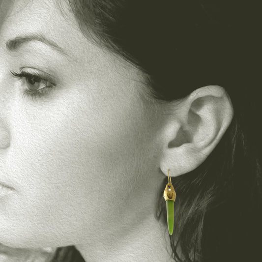 Earrings designed and made by Susan Crow Studio, Arizona Nephrite cone shaped gemstones are set in our hand carved and cast in recycled 18kt yellow gold earrings, one of a kind. Shown on Model