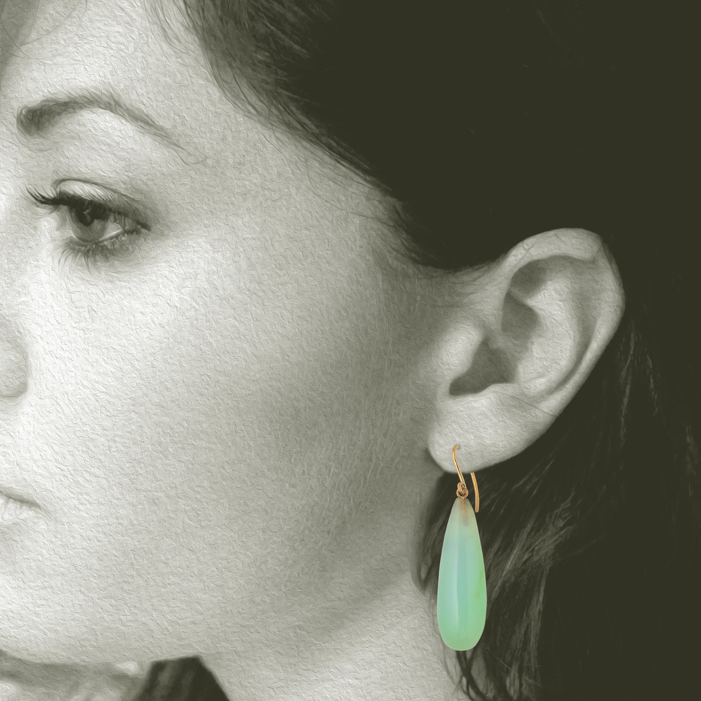 Iridescent Peruvian Opals carved into soft drop earring with recycled 18kt yellow gold ear wires. Designed and made in Minnesota. Opals mined in Peru. Shown on model for scale.