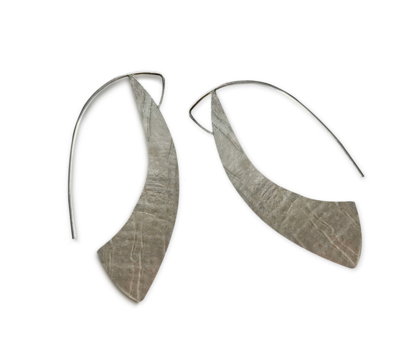 Our Sterling Silver Silhouette Hoop Earrings are a contemporary take on a classic look. Hand crafted in recycled sterling silver, these lightweight and comfortable earrings offer a beautiful snapshot of your personal style.
A must-have for everyday wear, their 1.5" long x 1" wide size ensures they stay perfectly in place, framing your face with effortless elegance. Allow 2-4 weeks for delivery, but if you have to have them sooner, please contact the studio and we will see if we can accommodate you.