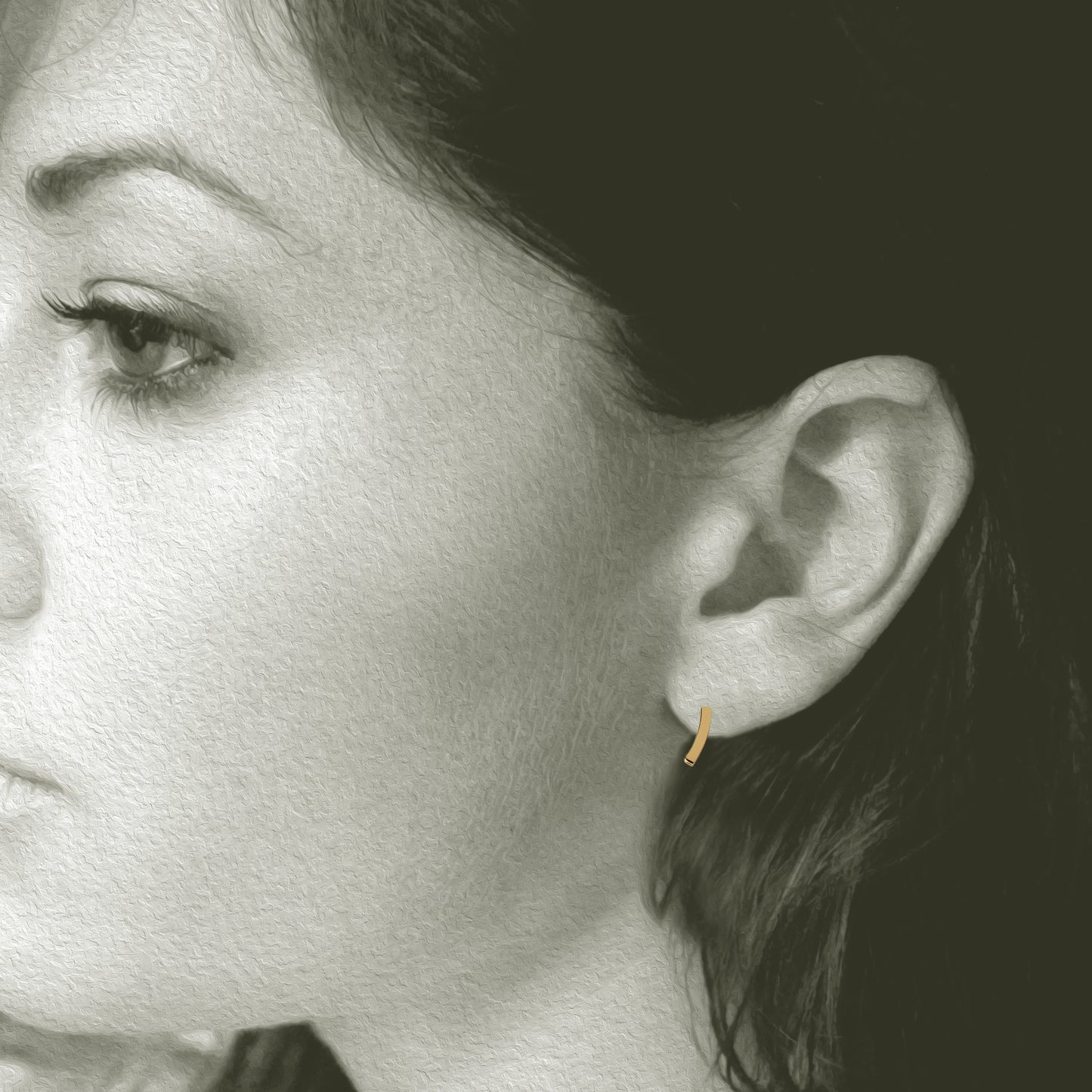 Slight Gold Earrings: Post earrings made in 14kt yellow gold. 3/8" long x 1/8" wide. Shown on Model