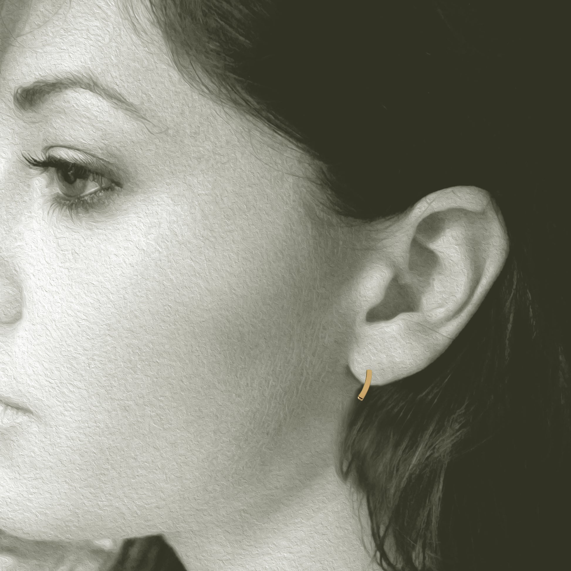 Slight Gold Earrings: Post earrings made in 14kt yellow gold. 3/8" long x 1/8" wide. Shown on Model