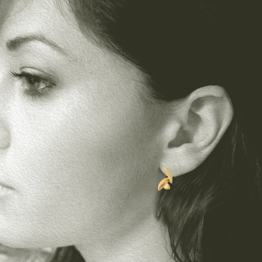 Our Petal Post Earrings are enough but not too much – made from 18kt Fairmined yellow gold, the Petal post earrings epitomizes elegant minimalism..
Shown on Model