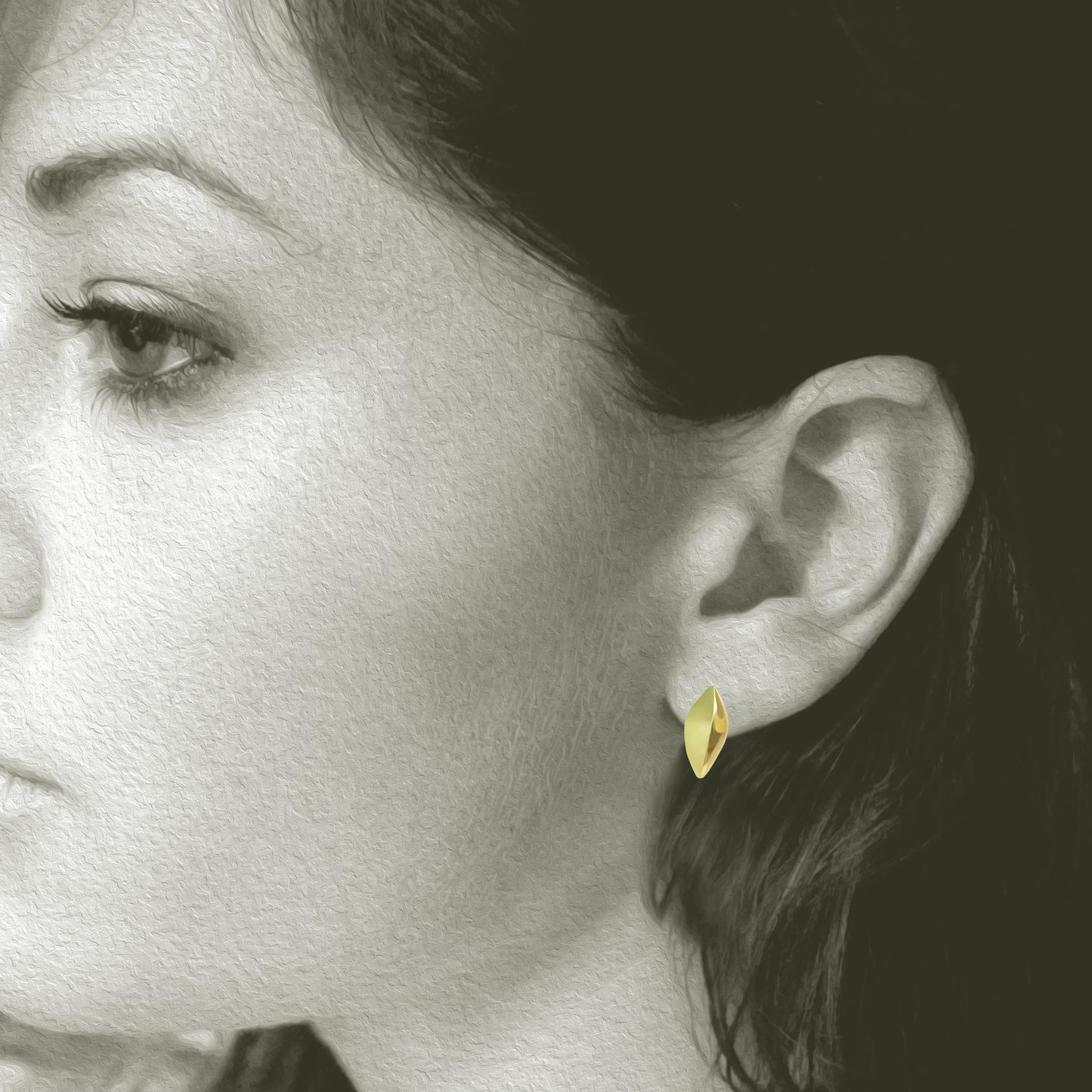 Small Modern and simple Leaf Design post earring made from 18kt Fairmined yellow gold. Perfect for everyday wear, .75" total length. Shown on Model