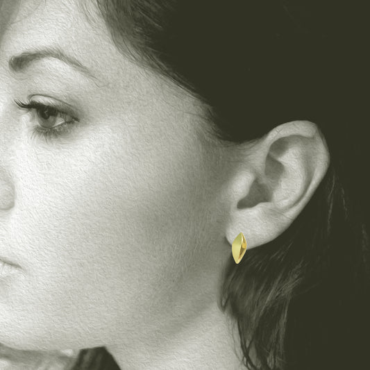 Small Modern and simple Leaf Design post earring made from 18kt Fairmined yellow gold. Perfect for everyday wear, .75" total length. Shown on Model