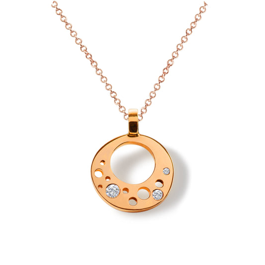 Crafted in 14kt certified recycled rose gold and reclaimed diamonds, the CIRCLE_INFINITE Pendant tells its own story of 'Less is More' when it comes to beauty and sophistication. 
Minimalism and functionality blend with industrial simplicity, mechanically and aesthetically, creating a symbiotic relationship – evident in this contemporary pendant.
Pendant is handcrafted in Minnesota with 14kt certified recycled gold and comes with an 18" 14kt rose gold chain.