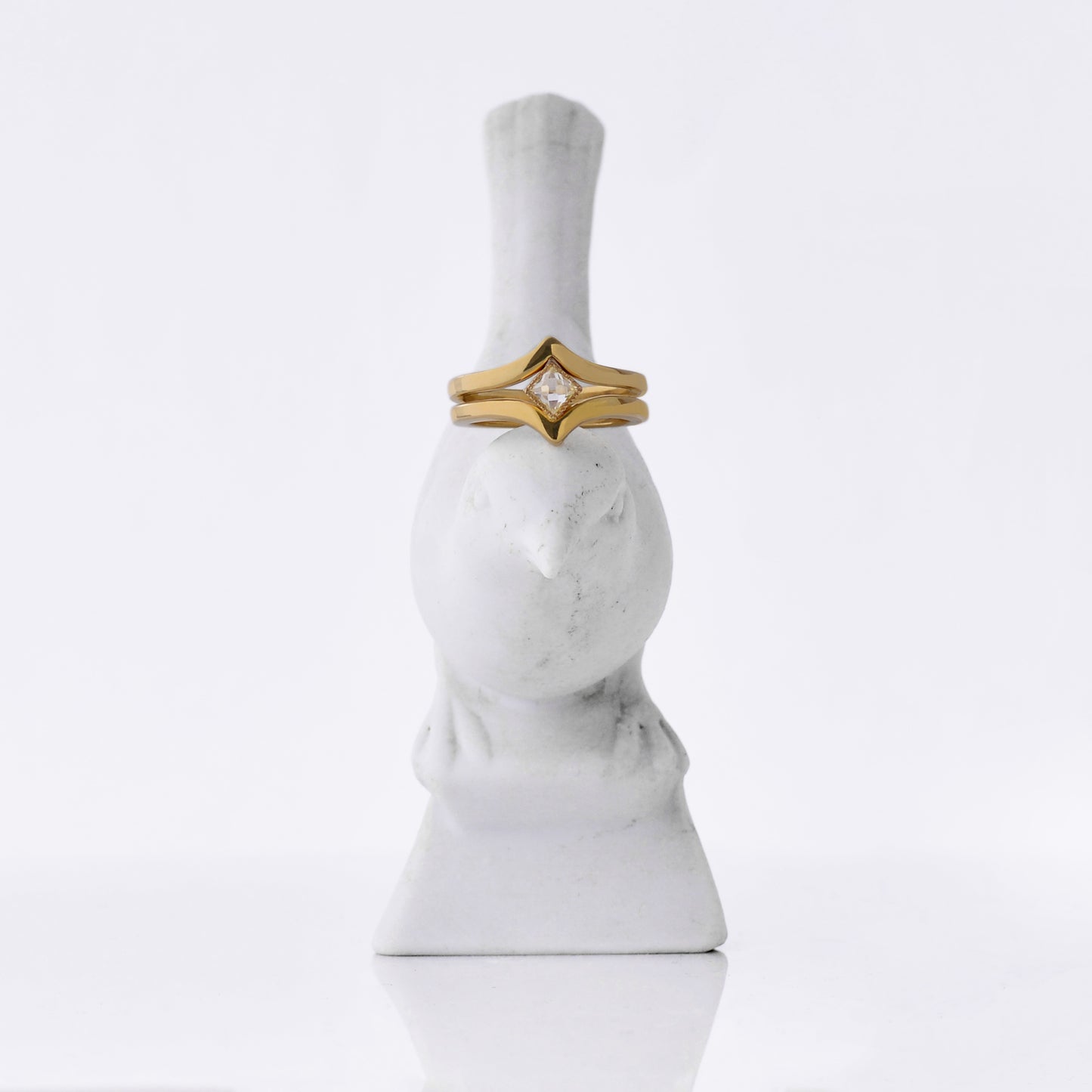 Lily Victory Engagement Ring, 32ct square 'Rose-Nouveau' diamond that was re-cut from a reclaimed antique diamond, similar to a rose-cut diamond
º Hand carved and cast in 18kt yellow Fairmined Gold
º Soft cashmere brushed finish
º Available in size 6.5.
Shown with the Lily Victory Band