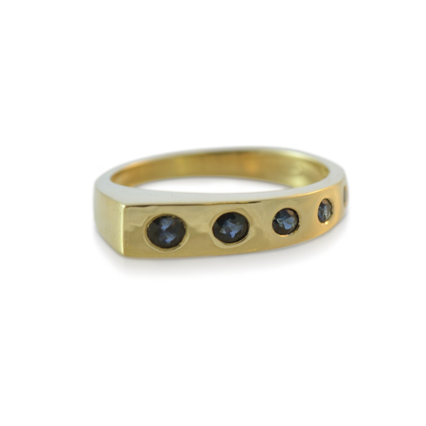 Our Wrapped with Sapphires Ring is like a blue waterfall flowing down your finger. Minimalistic in design and easy to wear with a low profile. Hand carved and cast in responsibly sourced recycled gold and set with 7 round Australian Sapphires.
Our gemstones are responsibly mined and cut, supporting mining and cutting communities. Learn about what this means when it comes to our jewelry supply chains.
Comfortable fit with a soft brushed finish and square bottom.
.23tcw