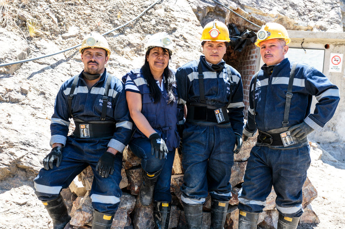 Photo shows gold miners standing together in a group.  They are Fairmined gold suppliers.