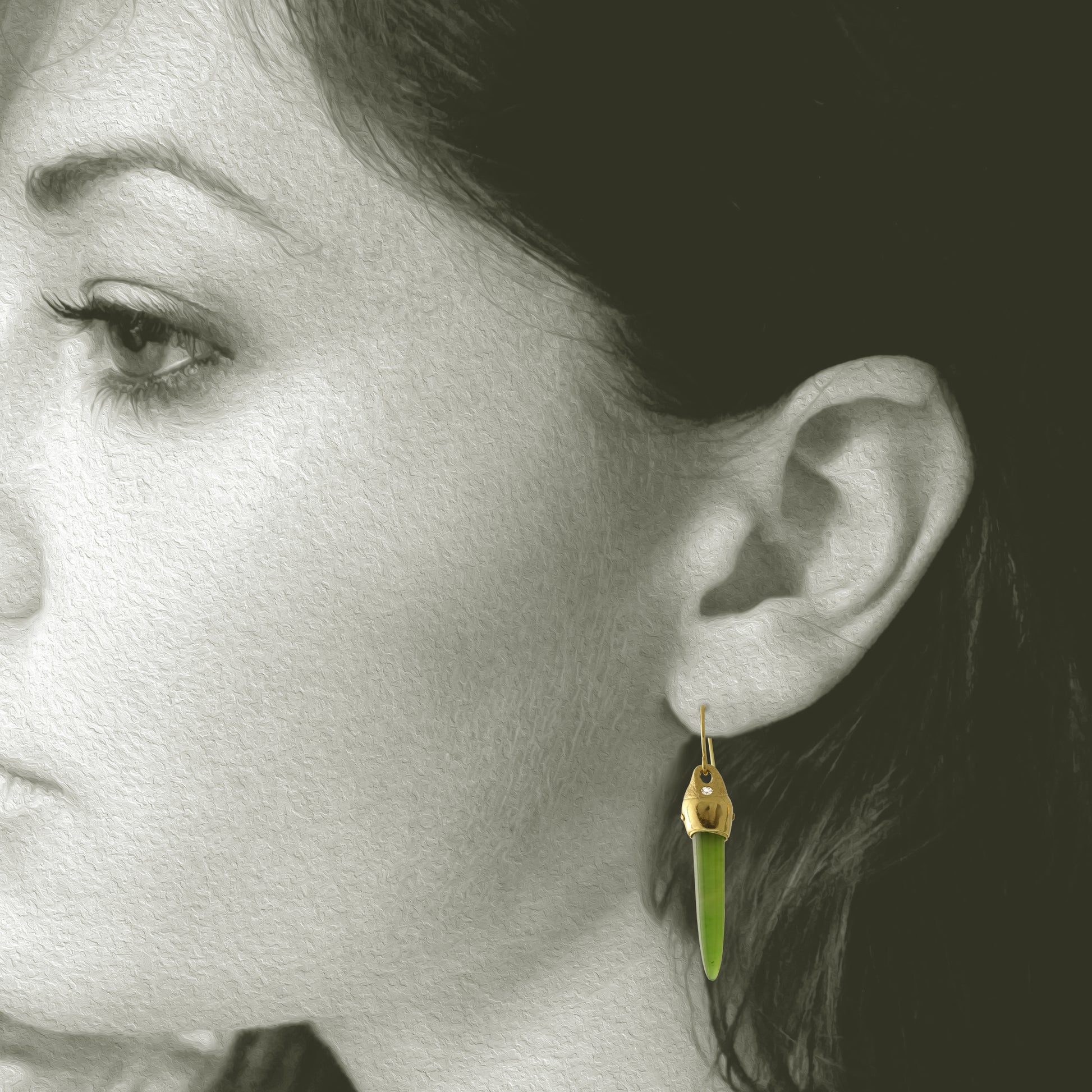 Earrings designed and made by Susan Crow Studio, Arizona Nephrite cone shaped gemstones are set in our hand carved and cast in recycled 18kt yellow gold earrings, one of a kind. Shown on Model
