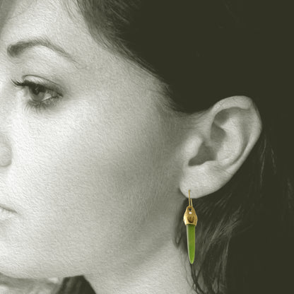 Earrings designed and made by Susan Crow Studio, Arizona Nephrite cone shaped gemstones are set in our hand carved and cast in recycled 18kt yellow gold earrings, one of a kind. Shown on Model