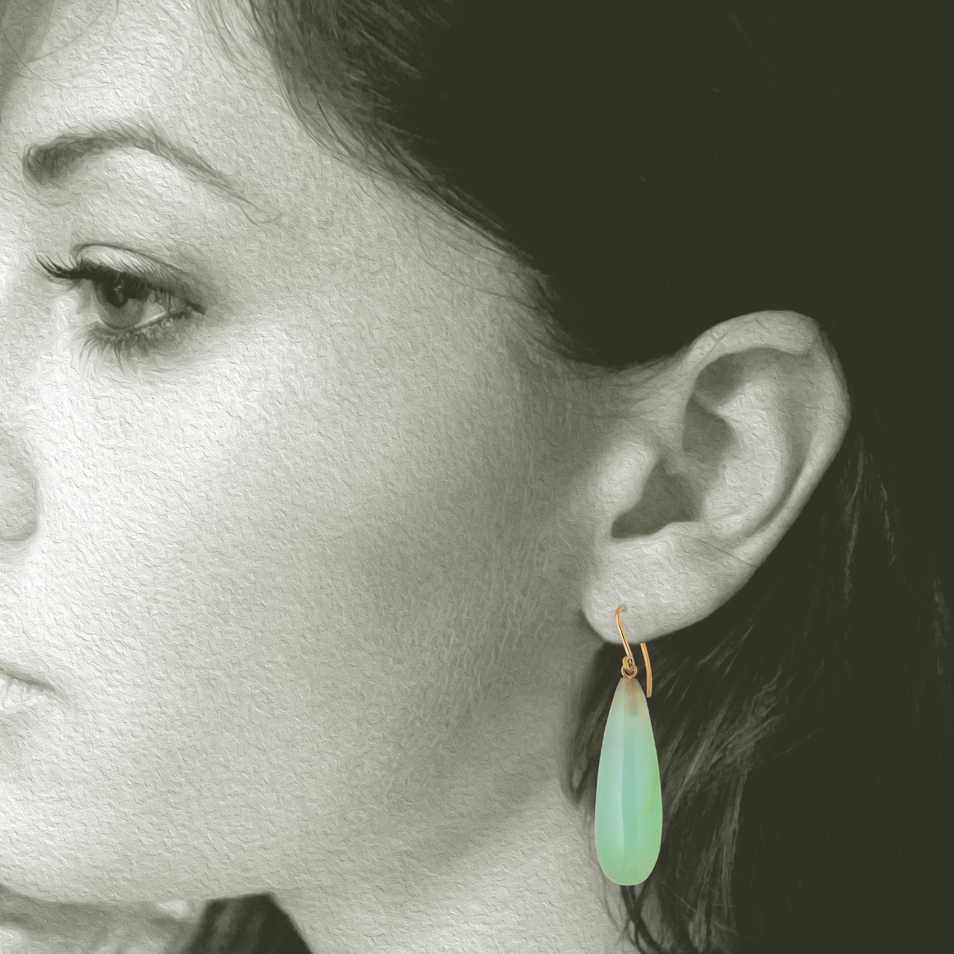 Iridescent Peruvian Opals carved into soft drop earring with recycled 18kt yellow gold ear wires. Designed and made in Minnesota. Opals mined in Peru. Shown on model for scale.