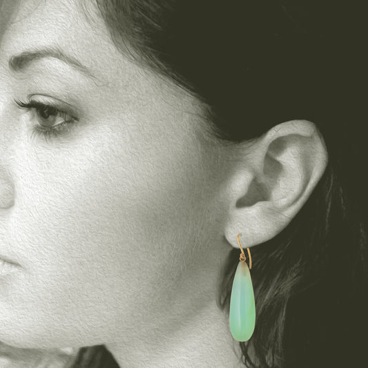 Iridescent Peruvian Opals carved into soft drop earring with recycled 18kt yellow gold ear wires. Designed and made in Minnesota. Opals mined in Peru. Shown on model for scale.