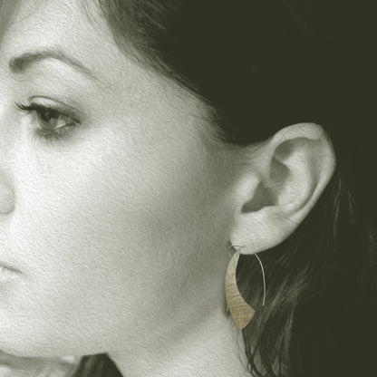 Our Sterling Silver Silhouette Hoop Earrings are a contemporary take on a classic look. Hand crafted in recycled sterling silver, these lightweight and comfortable earrings offer a beautiful snapshot of your personal style.

A must-have for everyday wear, their 1.5" long x 1" wide size ensures they stay perfectly in place, framing your face with effortless elegance. Allow 2-4 weeks for delivery, but if you have to have them sooner, please contact the studio and we will see if we can accommodate you. 