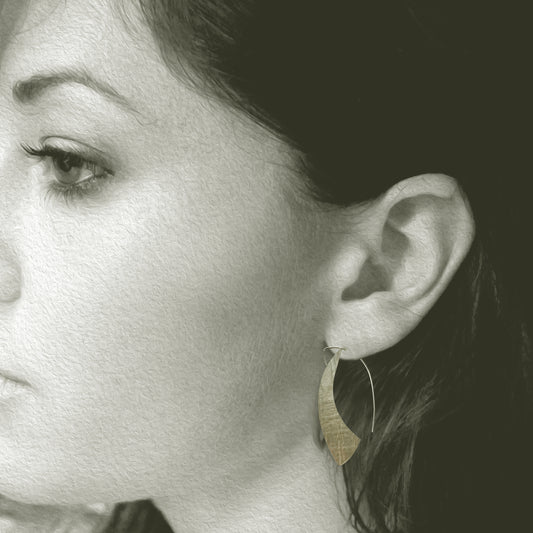 Our Sterling Silver Silhouette Hoop Earrings are a contemporary take on a classic look. Hand crafted in recycled sterling silver, these lightweight and comfortable earrings offer a beautiful snapshot of your personal style.

A must-have for everyday wear, their 1.5" long x 1" wide size ensures they stay perfectly in place, framing your face with effortless elegance. Allow 2-4 weeks for delivery, but if you have to have them sooner, please contact the studio and we will see if we can accommodate you. 