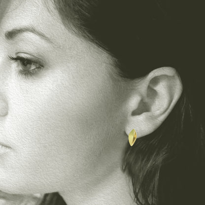 Small Modern and simple Leaf Design post earring made from 18kt Fairmined yellow gold. Perfect for everyday wear, .75" total length. Shown on Model