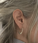 Modern Post Hoop Earrings shown on a model. Sterling Silver or 14kt Gold
