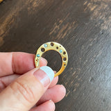 Circle Shaped Flat Ring º Unusually comfortable worn as a thumb ring or on your middle finger  º Hand-carved and cast in 14kt recycled gold.   º 3 flush set aquamarines  º Comfortable inside fit  º Cashmere finish.  º Available to ship in a size 7. 