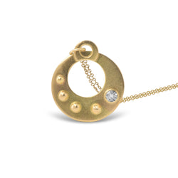 The Circle Shield Motif that you wear over your heart helps you visualize your inner strength that gives you your personal power.

Hand Fabricated in 18kt recycled yellow gold and a round white 3.5mm reclaimed diamond, the CIRCLE SHIELD Pendant encourages us to savor the important moments and gently reminds us that we own our power, no one else.

The Circle Shield Pendant is handcrafted in Minnesota from 18kt yellow gold recycled in studio forged from retired jewelry.  