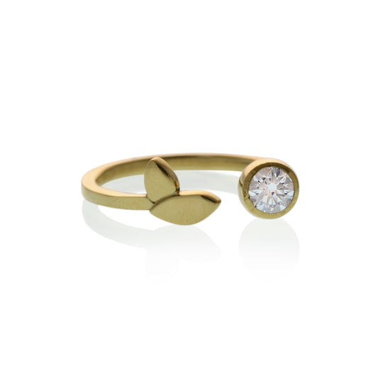 18kt Fairmined yellow gold Flora Leaf diamond ring with 4mm round diamond on white background"