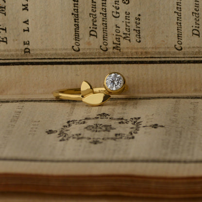 Flora Leaf diamond ring in 18kt yellow gold styled with book, alternative engagement ring"