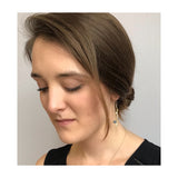 Milky-blue rose cut 6.5mm round responsibly sourced sapphires are bezel set in our Recycled 18kt gold Branch earrings with 18kt yellow gold french style ear wire. 2" long