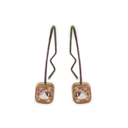 Part of our silver collection, these genuine Morganite Hoop Earrings offer an alternative artistic impression. Pink sparkling Morganite gemstones bezel set in 18kt yellow gold with sterling silver hoops.