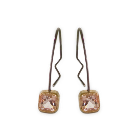 Part of our silver collection, these genuine Morganite Hoop Earrings offer an alternative artistic impression. Pink sparkling Morganite gemstones bezel set in 18kt yellow gold with sterling silver hoops.