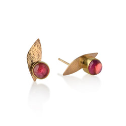 Our Major Post Earrings aren't really major, but will make you feel that way. Rose colored 5.5mm Rhodolite Garnets are bezel set in our 14kt gold and post earrings – are perfect when you want a post earring that has more presence than a smaller stud earring.
