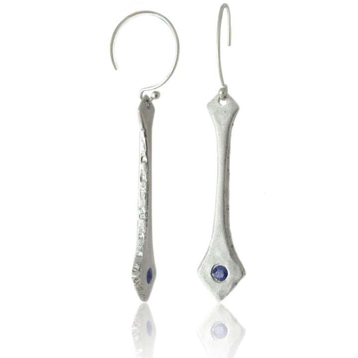 Our Blue Sapphire and Sterling Silver Earrings are inspired by the textures of grass blowing on the edge of a beach sand dune.   Features  º Modern drop earrings are handmade  º Made from recycled sterling silver  º Reclaimed 2.8mm round genuine blue sapphires  º 1 1/2