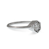 Art Deco inspired hexagon shaped engagement and wedding ring set. Milgrain edged hexagon shape holds the .50CT diamond or 5mm sapphire. Matching 1.5mm wedding ring sits next to engagement ring.