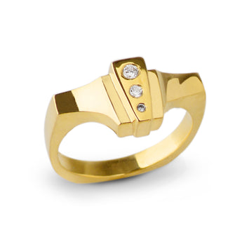 Lliad Ring crafted out of 18kt Fairmined gold and reclaimed white round diamonds has a hint of historical design with a modern spin. When you look down at your hand, you will fall in love each time with the diamond sparkle and spacial planes. Wear it on your middle finger or ring finger for a bold graphic statement. FEATURES: º Hand carved and cast in 18kt certified Fairmined Gold. º Comfortable fit with a flat bottom shank º Soft cashmere finish º Original design that stacks easily with other rings