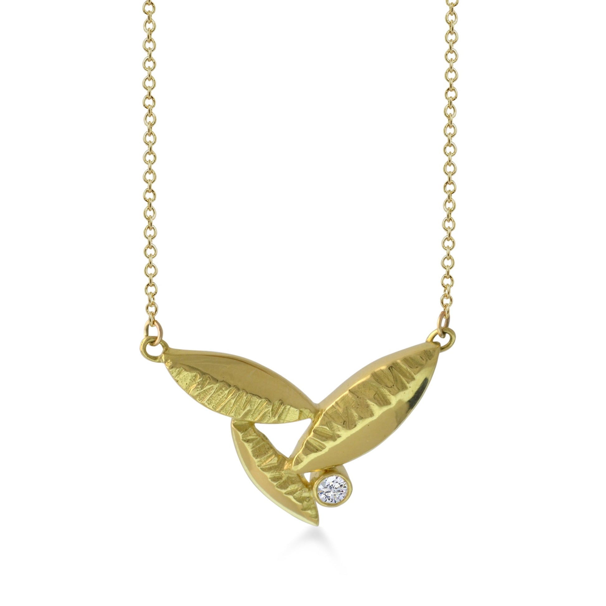 Susan Crow Studio's 18kt Fairmined yellow gold and diamond pendant is the perfect size for a diamond Flora Leaf Pendant. Hand carved and cast in their Minnesota studio.