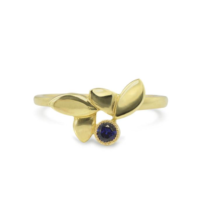 East Fourth Street Jewelry, responsibly sourced blue sapphire and 18kt Fairmined yellow gold ring. Modern Leaf design is hand carved and cast by designer Susan Crow..