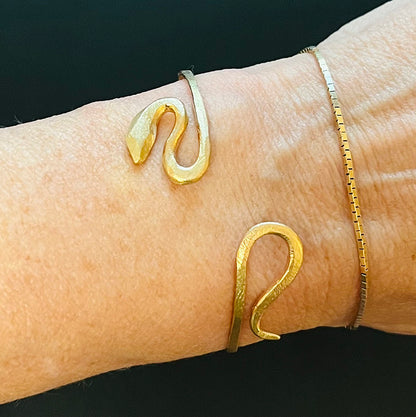 14kt yellow gold Snake bracelet designed and made by Susan Crow Studio. Snake gently wraps around your wrist.